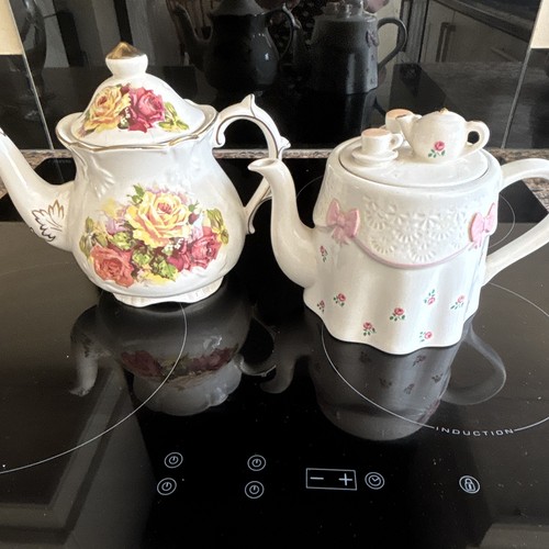 Ceramic tea pots with pink - tea,