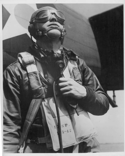 Pilot full combat gear beside
