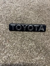 Toyota Corolla AE92 GTi EE90 GL Front Grille Badge Genuine New Old 75311-1A460
