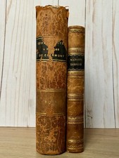 Two antique brown hardback