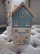 NEXT WOODEN BEACH HUT DOOR