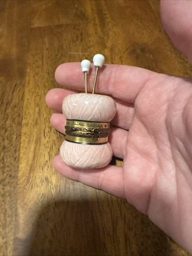 Pink yarn and needles - and,