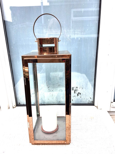 Tall copper coloured metal - copper,