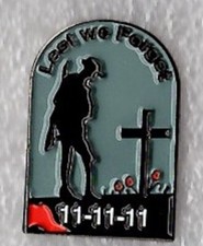 Soldier at graveside pin