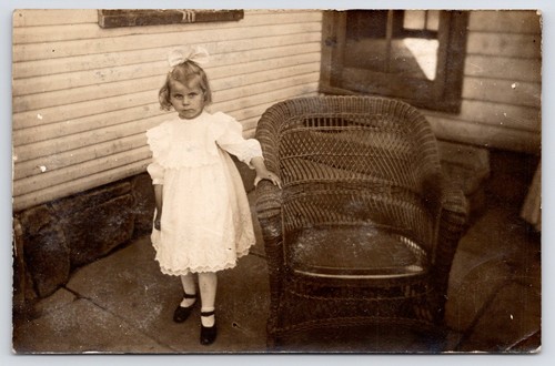 Rppc serious girl empty wicker - rppc,