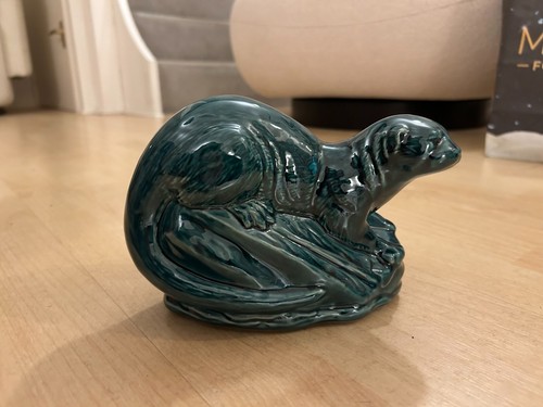Poole blue glazed otter - on, a