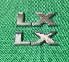 LX - VINTAGE  CAR BADGES / EMBLEMS - 57 X 22  MM
