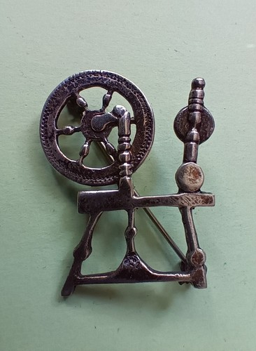 Vintage spinning wheel brooch