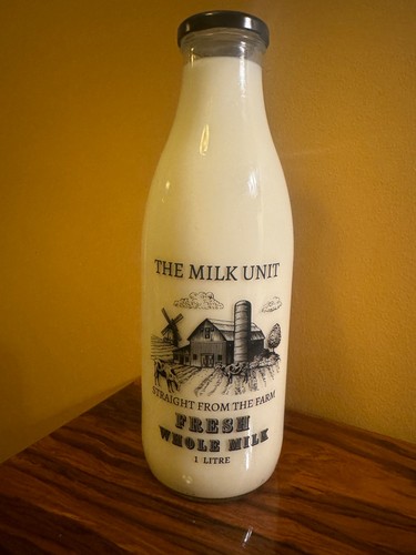 Litre glass milk bottle with - milk,