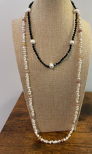 2 GENUINE PEARL NECKLACES; BLACK BEADS & FRESHWATER PEARLS WITH PINK BEADS