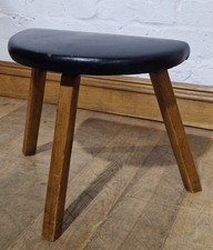 The other isA vintage mid century footstool / small tripod stool