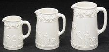 Wedgwood Queensware Embossed Sacrifice Cream on Cream 3 Graduated Pitchers 1960s