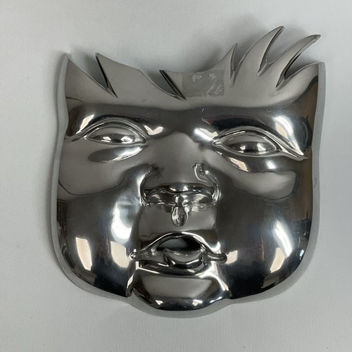 Large chrome metal - metal, smiling