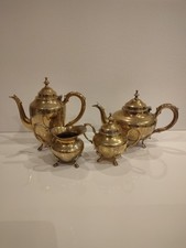 antique gold-colored four-piece tea set Was in use
