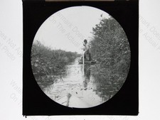 Man Poling Punt Boat Waterway