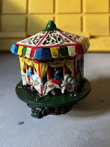 Antique cast iron carousel - cast,