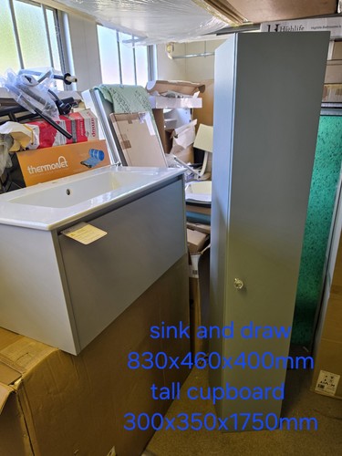 Bathroom sink and cupboard - and,
