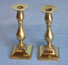 A Pair Of Antique Brass Georgian Style Brass Candlesticks. 18cms high.