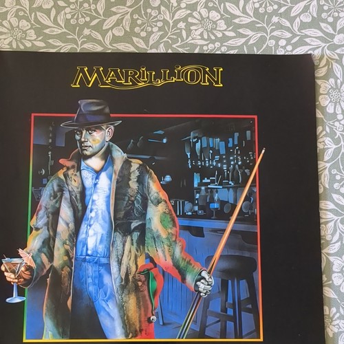 Marillion clutching straws - at,