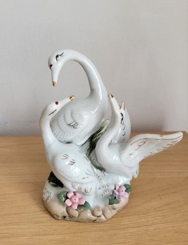 Vintage porcelain swan family