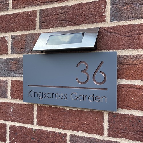 House number plaques with - number,