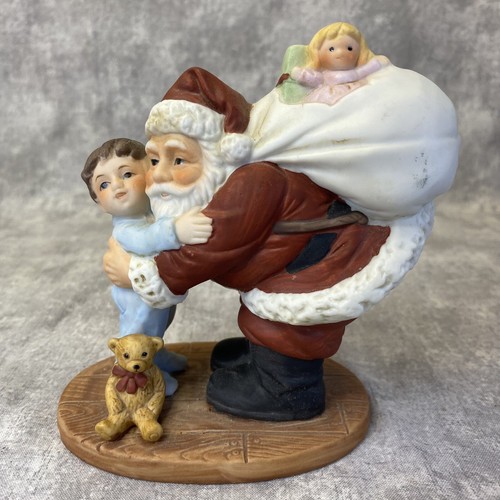 Homco santa hugging little - hugging,