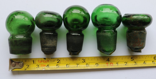 Five green bottle stoppers - five,