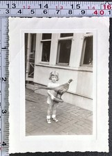 Little Girl Holding Stuffed