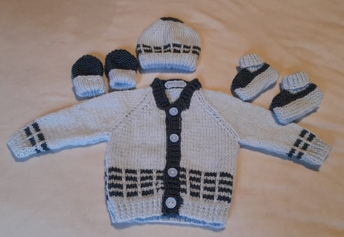 New born hand knitted baby - hand,