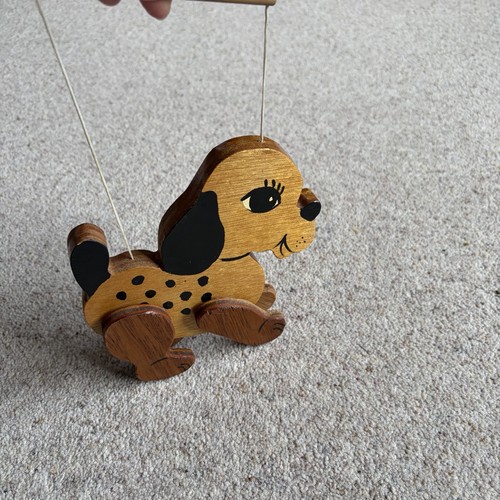 Wooden dog puppet string - on,