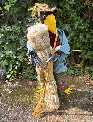 Scarecrow crow with broomstick