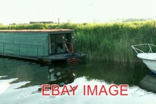PHOTO  THREE HOLES PEDAL POWERED RIVER BOAT VIEW TO THE STERN OF . IF THIS REALL