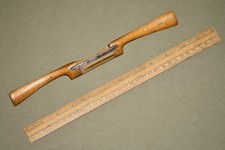 Beechwood spokeshave with curved brass sole.