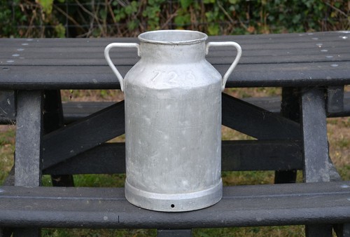 Vintage old aluminium milk