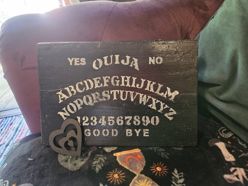 Ouija board hand made with - hand,