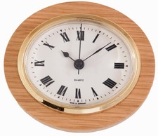Oval Clock Suitable for Caravans, Motorhomes and Boats. Roman with brass bezel
