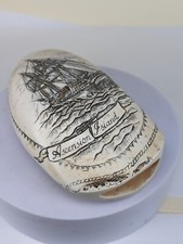 A faux scrimshaw whales tooth