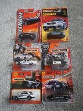 Matchbox 6 police cars from various years. new ads sealed packaging