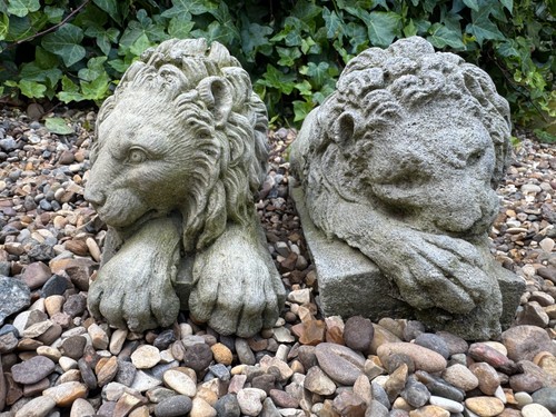 Pair vintage recumbent cast - of,
