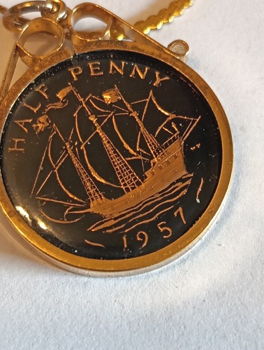1957 enameled half penny - half, coin