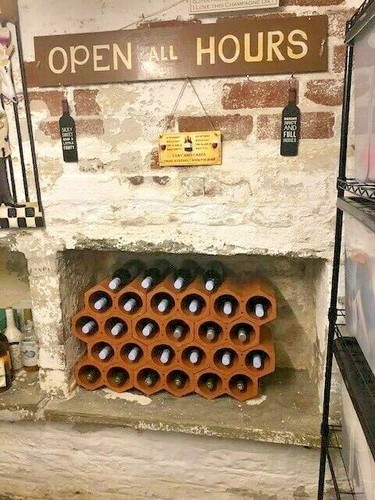 Terracotta wine rack with - wine,