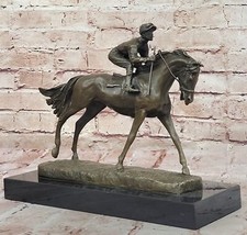 JOCKEY RIDING BRONZE STATUE