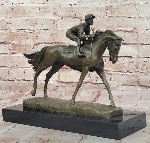 Jockey riding bronze statue - riding,
