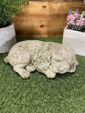 STONE GARDEN LYING SPANIEL DOG