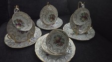 A Set Of Five Tea Cup Trios