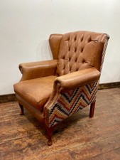 Tan leather wingback armchair