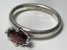 'SPINNING 925' sterling silver and oval garnet ring band size M JANUARY BIRTHDAY