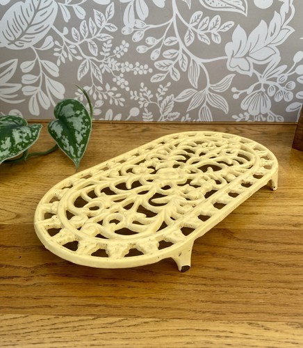 Vintage cast iron trivet cream - trivet,
