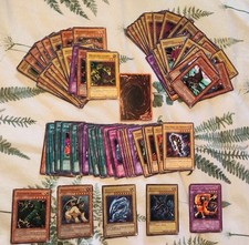 Vintage Yu-Gi-Oh TCG cards including Blue Eyes White Dragon SDK-E001