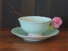 Paragon Rose Handled Cup & Saucer by appointment to HRM The Queen & HRM Q Mary
